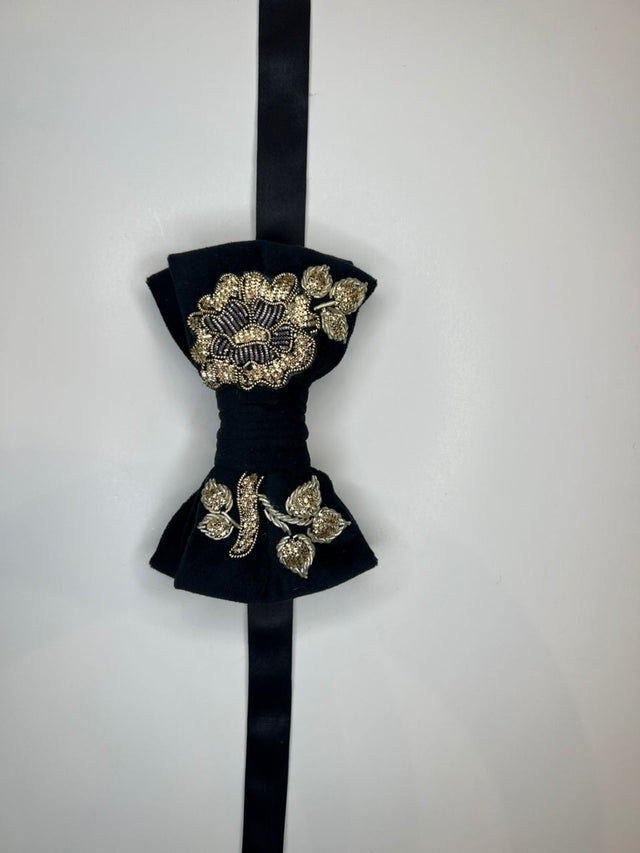 Black velvet bow tie with gold and silver floral Sermeh embroidery, shown flat against a plain white background.